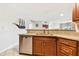 A kitchen with stainless steel dishwasher and granite countertops at 6151 Bahia Del Mar Blvd # 125, St Petersburg, FL 33715