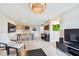 Open living space featuring tile flooring, a dining area, and views into the kitchen at 6151 Bahia Del Mar Blvd # 125, St Petersburg, FL 33715
