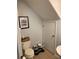 Cozy bathroom with a toilet, sink, and humorous wall art, plus convenient pet feeding station at 9871 Trumpet Vine Loop, Trinity, FL 34655
