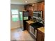 Well-equipped kitchen featuring granite countertops, stainless steel appliances, and ample cabinet space at 9871 Trumpet Vine Loop, Trinity, FL 34655
