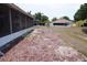 Residential backyard features some mulch and a view of neighboring homes at 10308 Soaring Eagle Dr, Riverview, FL 33578