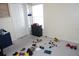 Bedroom with neutral walls, carpet flooring, and closet with shelving at 10308 Soaring Eagle Dr, Riverview, FL 33578