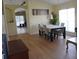 Open dining area with hardwood floors, large windows, and modern furnishings at 10308 Soaring Eagle Dr, Riverview, FL 33578