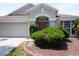 Charming home exterior showcasing a well-manicured lawn and inviting front entrance at 10308 Soaring Eagle Dr, Riverview, FL 33578