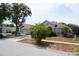 Home exterior showcases a well-manicured lawn and mature landscaping at 10308 Soaring Eagle Dr, Riverview, FL 33578