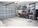 Spacious garage offering ample storage and parking space, complete with shelving and a clean layout at 10308 Soaring Eagle Dr, Riverview, FL 33578