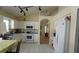 Bright kitchen featuring white cabinetry, tile floors, and modern appliances at 10308 Soaring Eagle Dr, Riverview, FL 33578