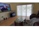 Bright living room with hardwood floors, a large window, and comfortable seating at 10308 Soaring Eagle Dr, Riverview, FL 33578