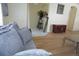 Comfortable living room with hardwood floors, neutral decor, and easy access to other living areas at 10308 Soaring Eagle Dr, Riverview, FL 33578