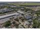 A community aerial view highlighting nearby commercial and residential areas as well as its proximity to the water at 4408 W Prescott St, Tampa, FL 33616