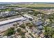 A community aerial view highlighting nearby commercial and residential areas as well as its proximity to the water at 4408 W Prescott St, Tampa, FL 33616