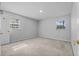 Serene bedroom with neutral walls, carpet flooring, and natural light from two windows at 4408 W Prescott St, Tampa, FL 33616