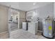 Functional laundry area with included washer, dryer, and water heater, plus convenient outdoor access at 4408 W Prescott St, Tampa, FL 33616