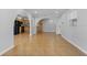 Open-concept living area with arched openings to kitchen and other rooms at 4408 W Prescott St, Tampa, FL 33616