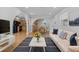 Comfortable living room with plush seating, bright decor, and open access to the kitchen and dining area at 4408 W Prescott St, Tampa, FL 33616