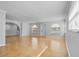 Bright, empty living room featuring tile flooring, arched doorways, and plentiful natural light at 4408 W Prescott St, Tampa, FL 33616