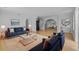 Bright living room featuring modern decor, plush seating, and open layout with arched doorways to other rooms at 4408 W Prescott St, Tampa, FL 33616