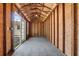 Interior view of the shed showcasing the wood framing, concrete floor, and ample storage space at 4408 W Prescott St, Tampa, FL 33616