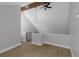 Bedroom featuring light-toned wood flooring, modern lighting and an exposed wooden beam at 5151 Puritan Cir # 1022, Tampa, FL 33617