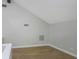 A bright bedroom featuring sleek, light-toned flooring and modern minimalist design elements at 5151 Puritan Cir # 1022, Tampa, FL 33617