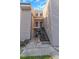 Low angle image of a two-story condo with neutral-toned siding and exterior staircases at 5151 Puritan Cir # 1022, Tampa, FL 33617