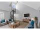 Bright living room featuring a spiral staircase, high ceilings, and contemporary furniture at 5151 Puritan Cir # 1022, Tampa, FL 33617