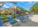 An inviting row of blue and white lounge chairs sit alongside the community pool at 5151 Puritan Cir # 1022, Tampa, FL 33617