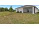 Spacious backyard and covered patio of this beautiful single Gathering home at 9195 Players Dr, Weeki Wachee, FL 34613