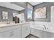 Elegant bathroom featuring double vanity, soaking tub, and modern fixtures for a luxurious experience at 9195 Players Dr, Weeki Wachee, FL 34613