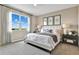 Bright bedroom featuring neutral walls, comfortable bedding, and serene decor, creating a relaxing atmosphere at 9195 Players Dr, Weeki Wachee, FL 34613