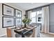 Elegant dining room with stylish decor, modern artwork, and plenty of natural light at 9195 Players Dr, Weeki Wachee, FL 34613