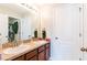 Well-lit bathroom with a double sink vanity, spacious counter tops, and a neutral color palette at 2746 Walden Woods Dr, Plant City, FL 33566