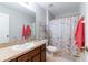 Bathroom with a single sink and floral shower curtain at 2746 Walden Woods Dr, Plant City, FL 33566