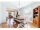 Open dining room features wood table, bench seating, and views into adjacent living area at 2746 Walden Woods Dr, Plant City, FL 33566
