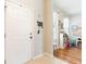 Welcoming foyer with a bright white door and tile flooring that leads to a versatile open room at 2746 Walden Woods Dr, Plant City, FL 33566