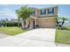 Attractive two-story home boasting a neatly kept lawn, an attached two-car garage, and lush landscaping at 2746 Walden Woods Dr, Plant City, FL 33566