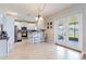 Bright eat-in kitchen features white cabinets, stainless appliances, and sliding door to the lanai at 2746 Walden Woods Dr, Plant City, FL 33566