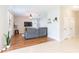Spacious living room features plush sectional sofa, ceiling fan and a door to a hallway at 2746 Walden Woods Dr, Plant City, FL 33566