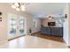 Open floor plan with sliding glass doors to the lanai connects the kitchen to the living room at 2746 Walden Woods Dr, Plant City, FL 33566