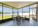 Relaxing screened patio with outdoor seating area overlooking the backyard and serene water views at 2746 Walden Woods Dr, Plant City, FL 33566