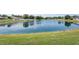 Scenic view of a large pond, enhancing the property's appeal and tranquility at 2746 Walden Woods Dr, Plant City, FL 33566