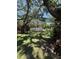 Tranquil backyard showcasing a swimming pool and shaded seating area at 870 Virginia St # 108, Dunedin, FL 34698