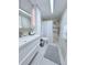 Modern bathroom featuring a sleek vanity, updated shower, and tiled walls at 870 Virginia St # 108, Dunedin, FL 34698