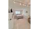 Well-lit bedroom with a comfortable bed, modern lighting, and ample storage space at 870 Virginia St # 108, Dunedin, FL 34698