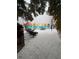 Charming courtyard with seating, a decorative mural, and views of the community at 870 Virginia St # 108, Dunedin, FL 34698