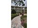 Attractive condo building boasting multiple stories, balconies and lush landscaping at 870 Virginia St # 108, Dunedin, FL 34698