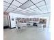 Community library featuring bookshelves filled with books, tables, chairs, and overhead lighting at 870 Virginia St # 108, Dunedin, FL 34698