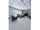 Inviting living room featuring comfortable seating, a fireplace, and natural light at 870 Virginia St # 108, Dunedin, FL 34698