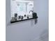 Stylish pass-through featuring a dark countertop, decorative items, and a view of the kitchen at 870 Virginia St # 108, Dunedin, FL 34698