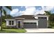 Inviting single-story home with a two-car garage and attractive stone and siding facade, perfect for modern living at 9058 Players Dr, Weeki Wachee, FL 34613